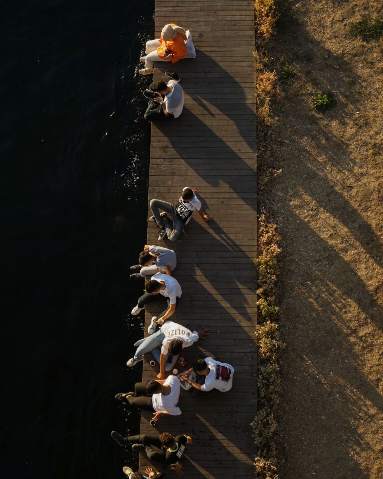 Overhead shot capturing people resting on a pier by the water in Istanbul, Turkey.